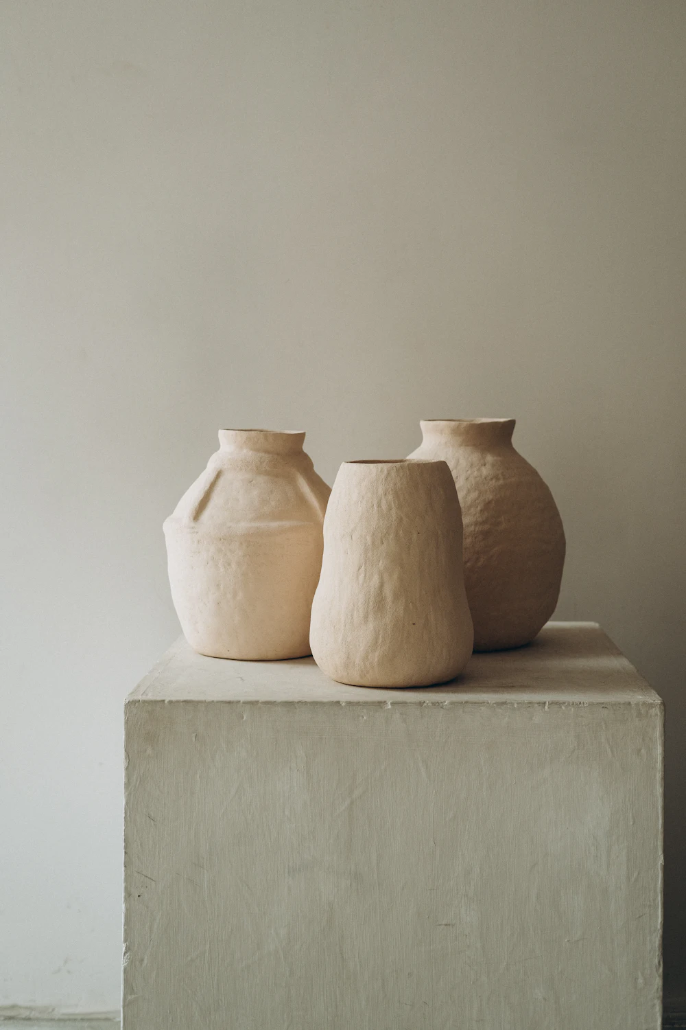 Stoneware vessels on a limestone plinth