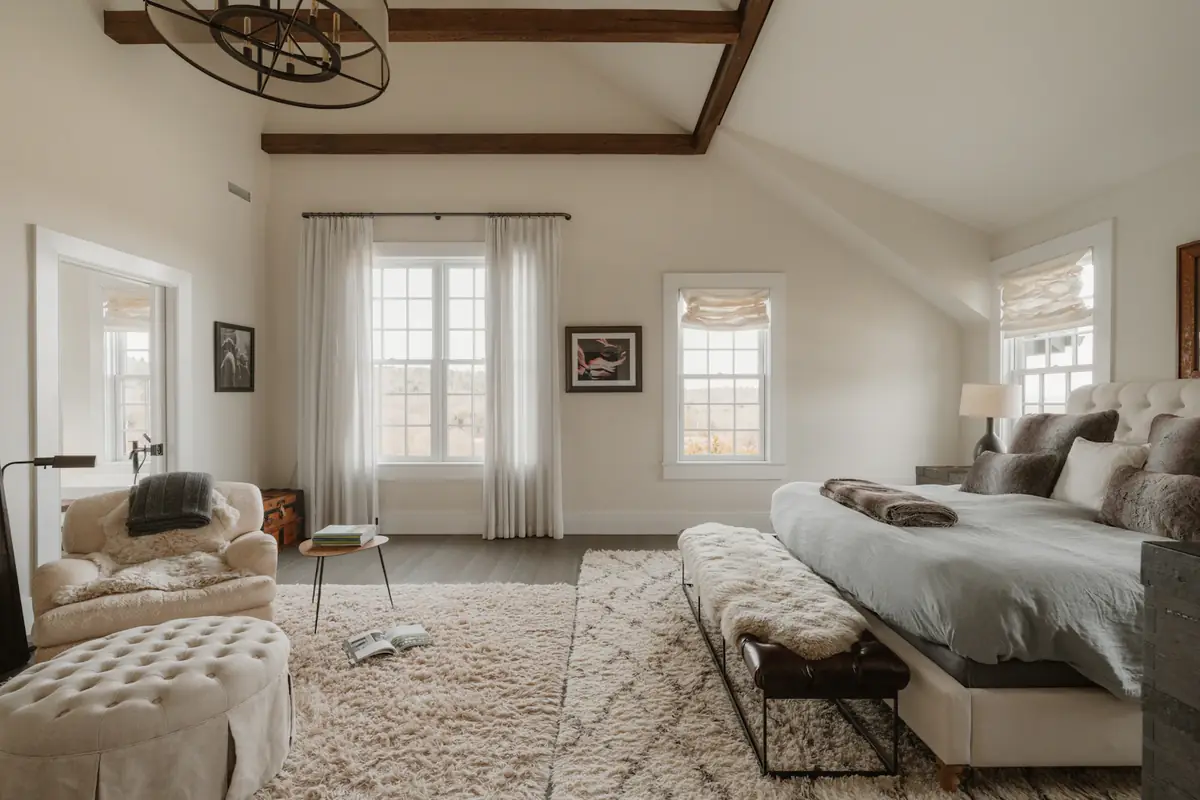 Finished main bedroom with a fireplace and wool rugs