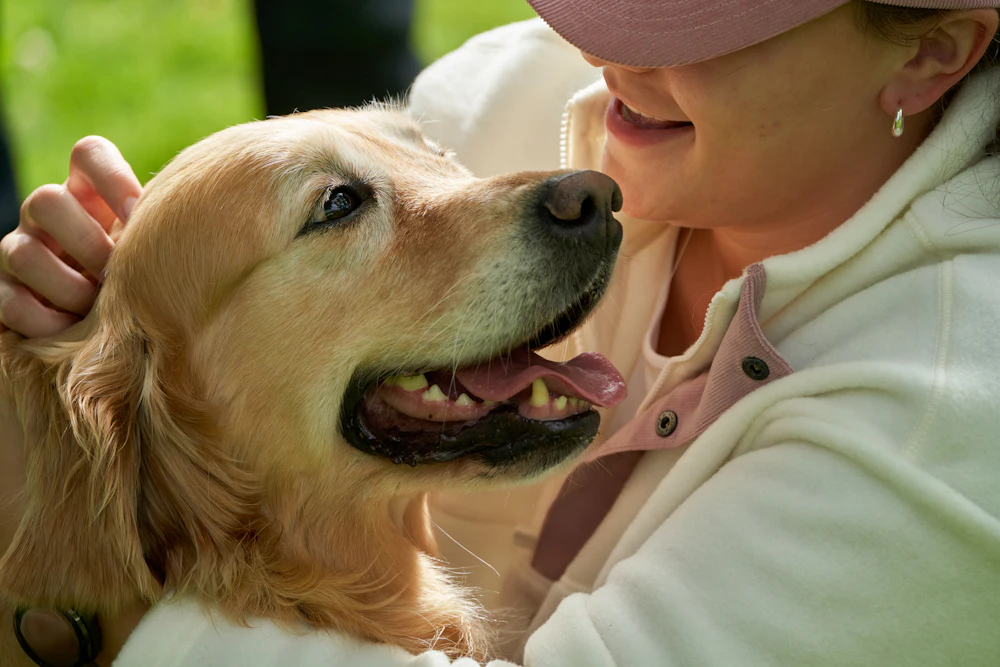 Grace with one of her golden retrievers