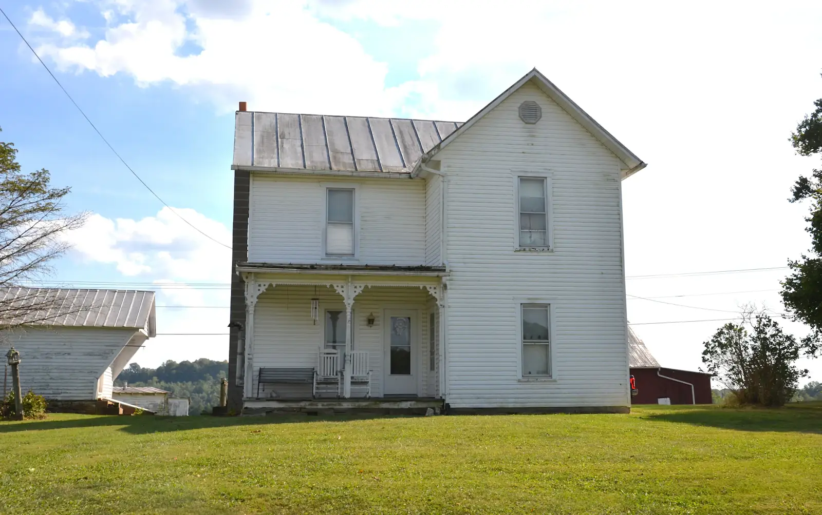 Our white farmhouse with a covered porch